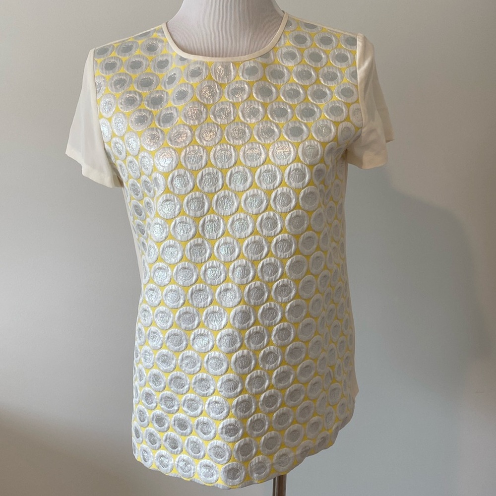 Women’s yellow and silver top.